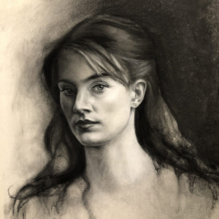 Charcoal portrait of girl on paper